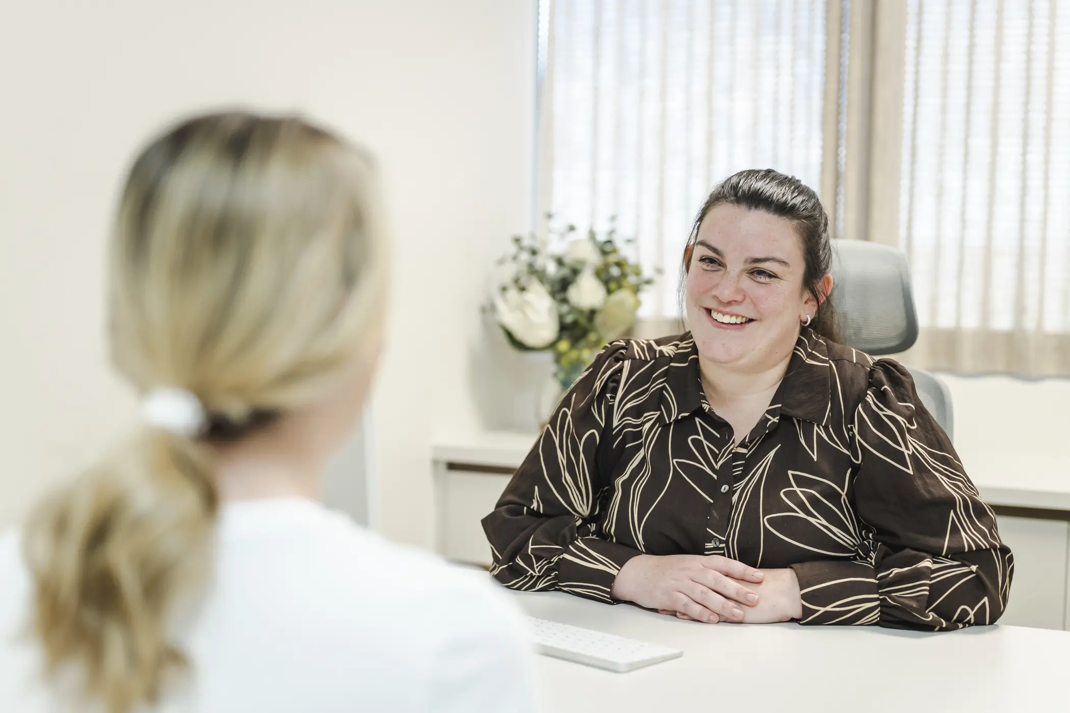 Clinician and patient in consultation